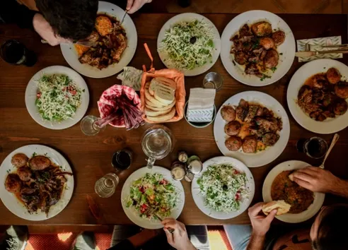 Ariel view of table with multiple bowls of food