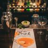 Ditch the Drink Recipe Book shown on top of a cocktail bar