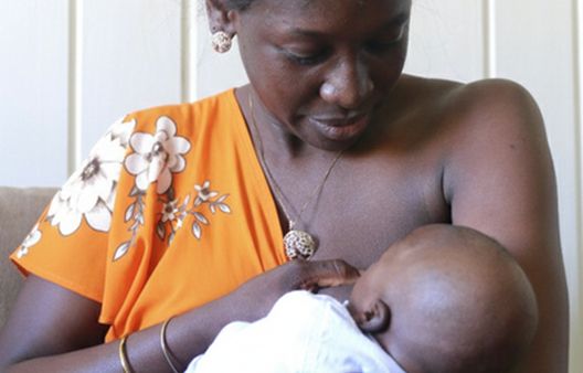 Close up of woman breastfeeding baby
