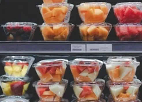 Fruit in packaging on shelf