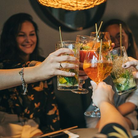 Group of friends cheers with mocktails