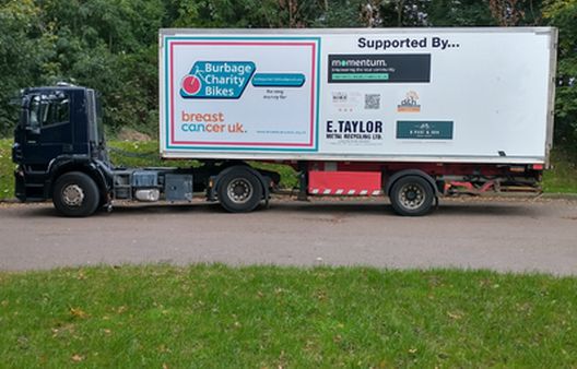 Burbage Bikes transport lorry displaying Breast Cancer UK logo
