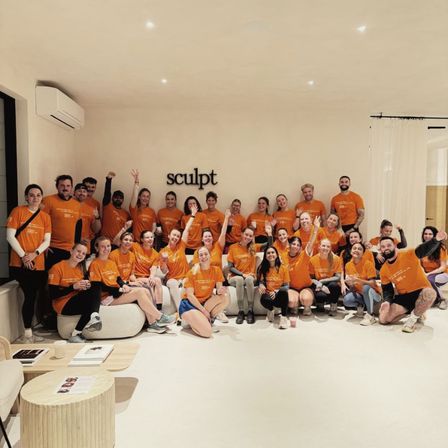 Team of people fundraising at work in Breast Cancer UK Tshirts