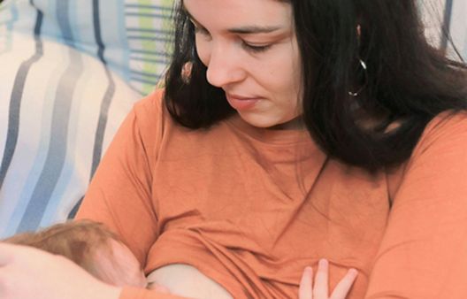 Close up of woman breastfeeding baby